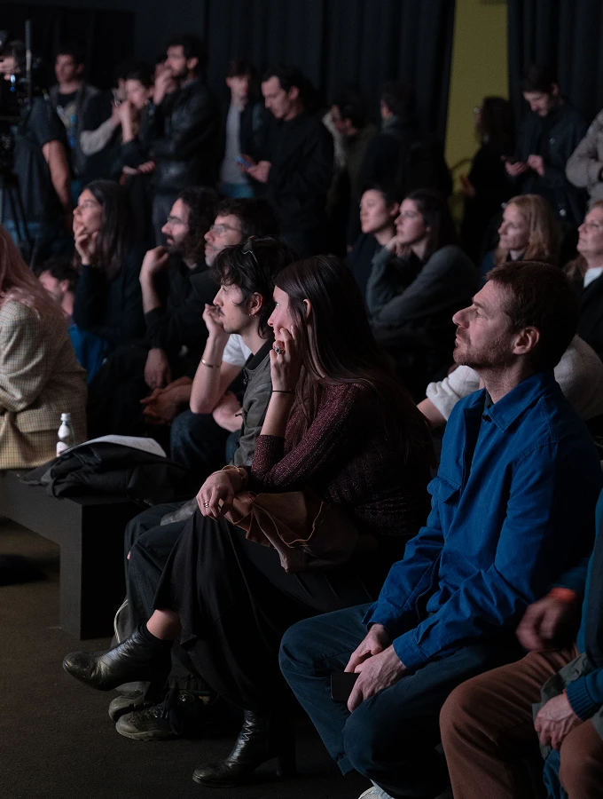 Audience seated and watching a performance.
