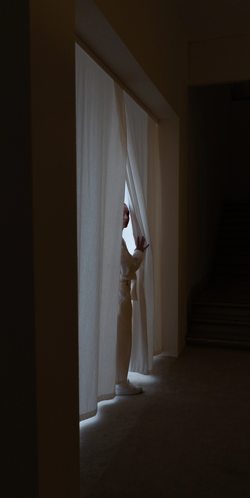 Silhouette of a visitor entering the Journey of Reflection exhibition space.
