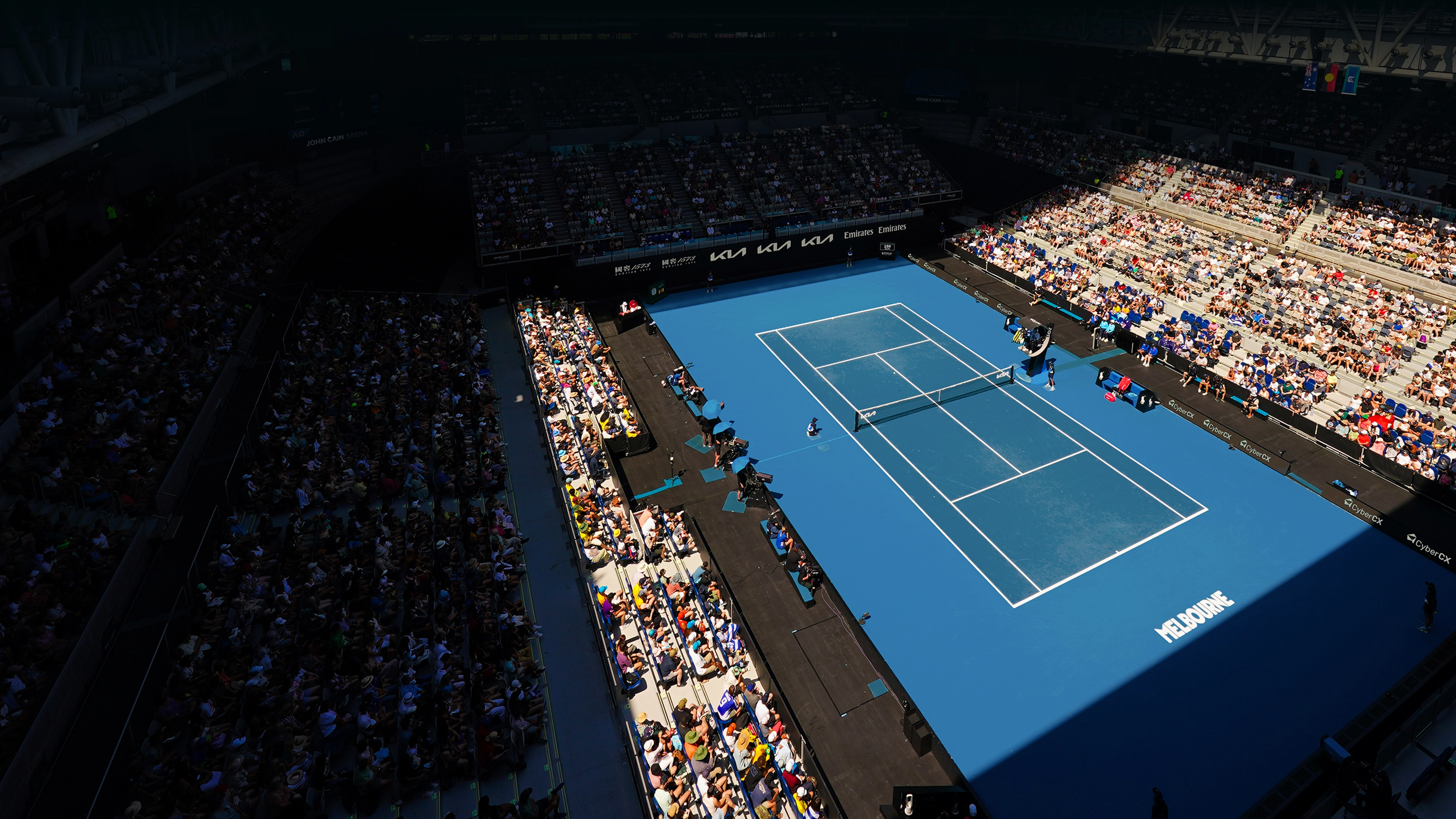 A daytime view of the Australian Open main court under natural light.