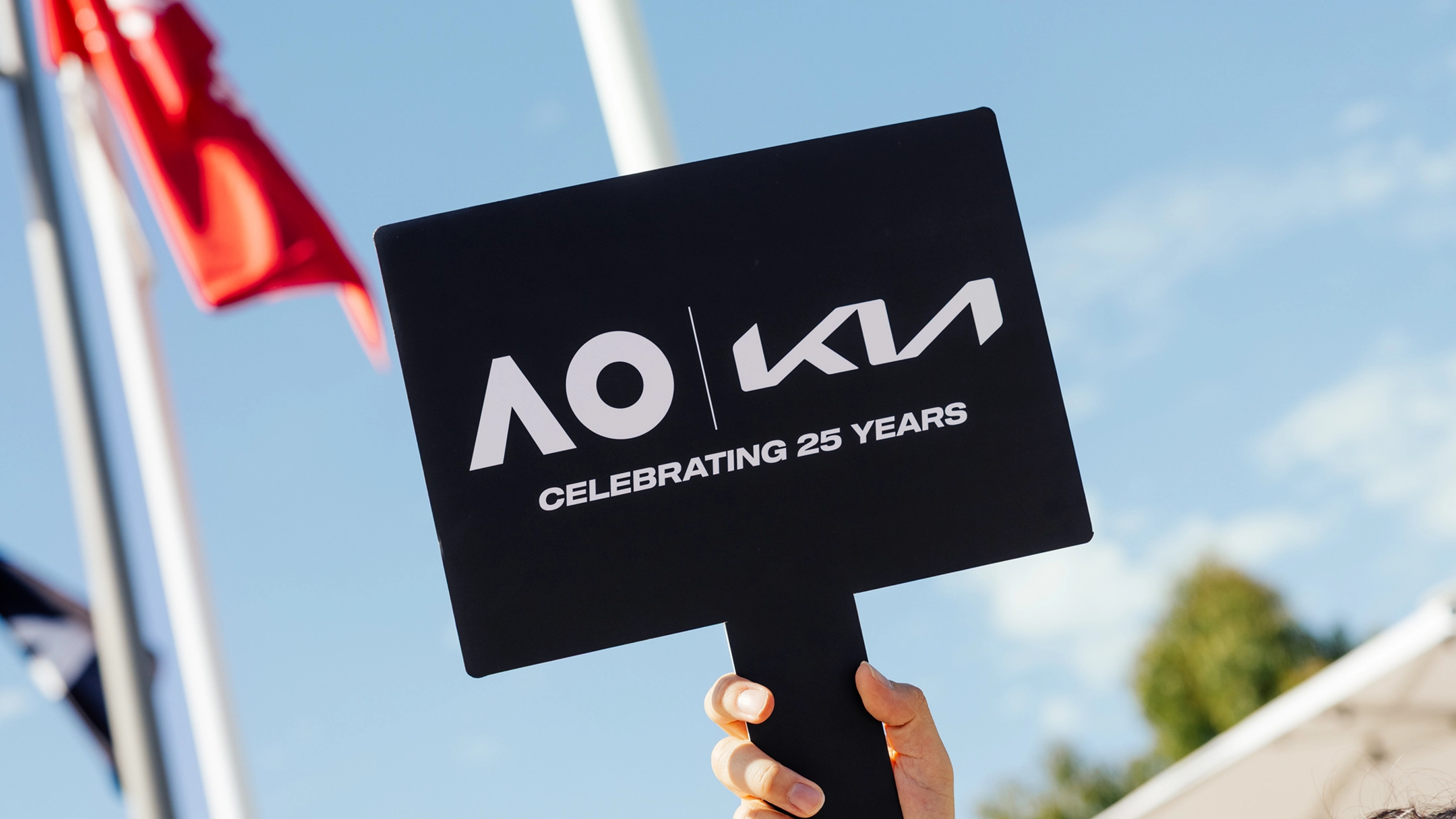 Image of a sign showing Kia Australian Open 25th anniversary logo