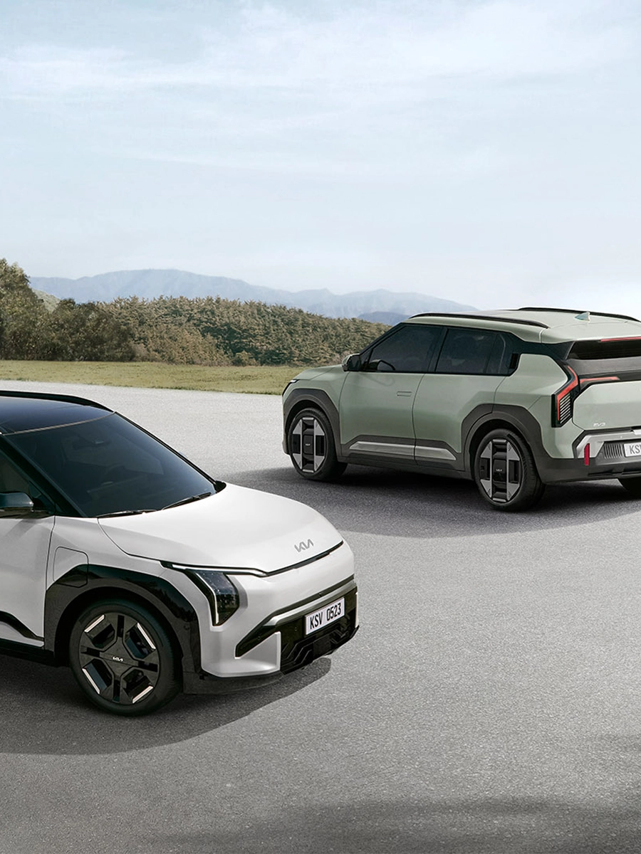 Image of two Kia EV3 vehicles on the road, winner of the 2024 TopGear.com Crossover of the Year