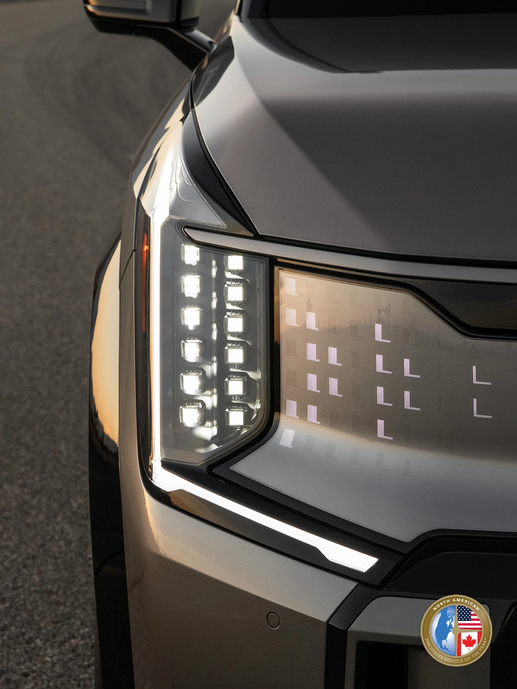Close-up image of the Kia EV9 front headlamp with digital pattern lighting