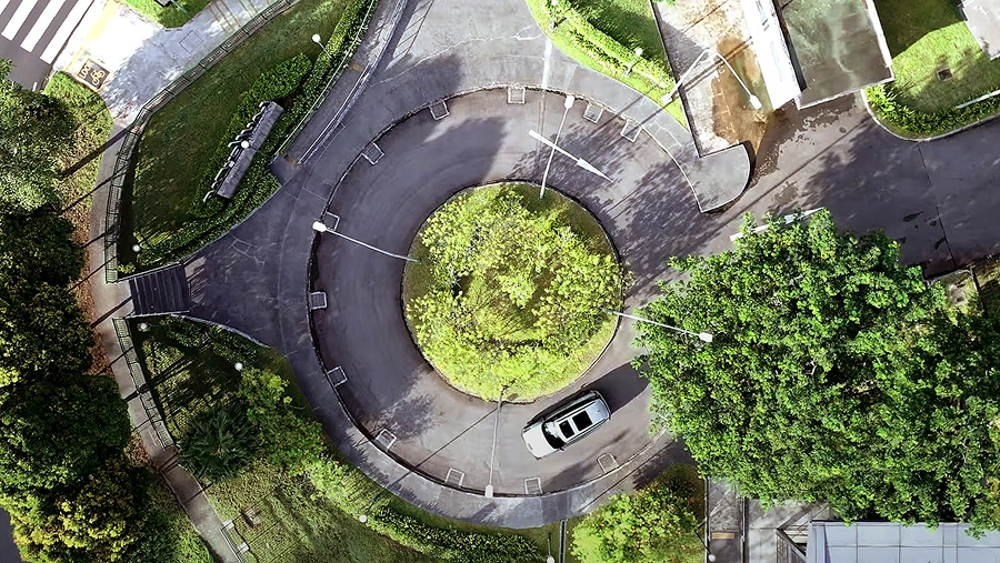 Aerial view of the Kia EV9 driving through a roundabout