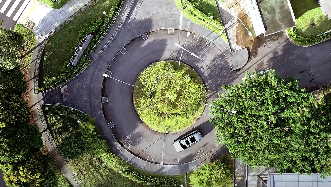 Aerial view of the Kia EV9 driving through a roundabout