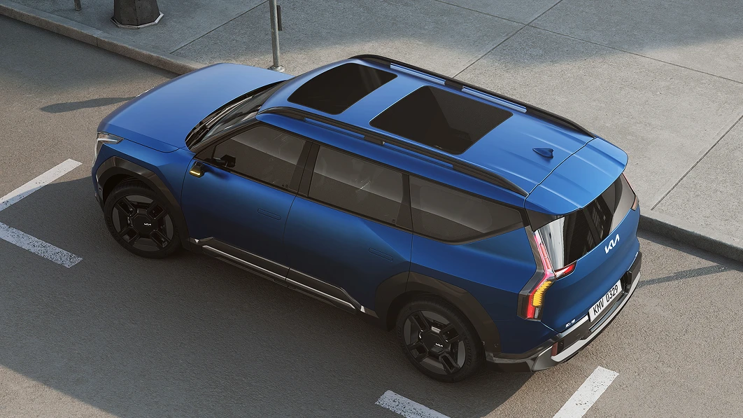 Top three-quarter view image of Kia EV9 parked in a parking space