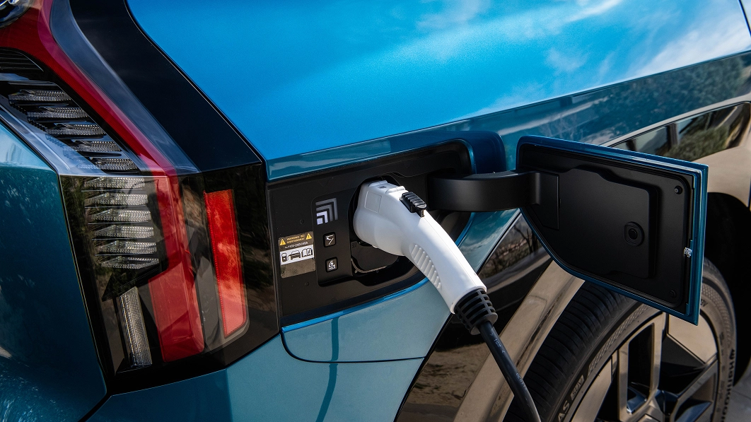 Close-up of the Kia EV9 using the V2L (Vehicle-to-Load) function