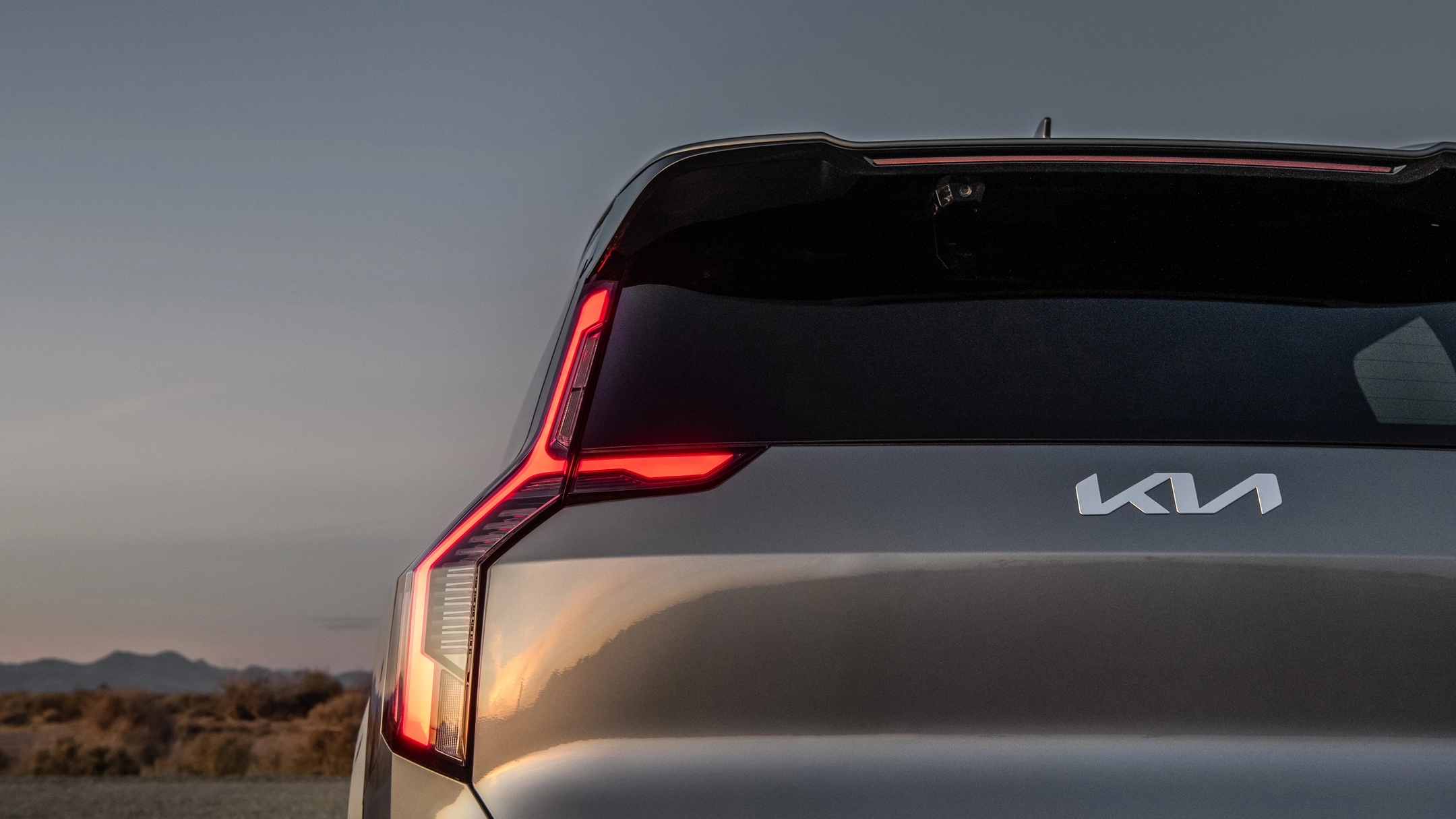 Close-up of the Kia EV9 rear lamp design featuring the Kia logo