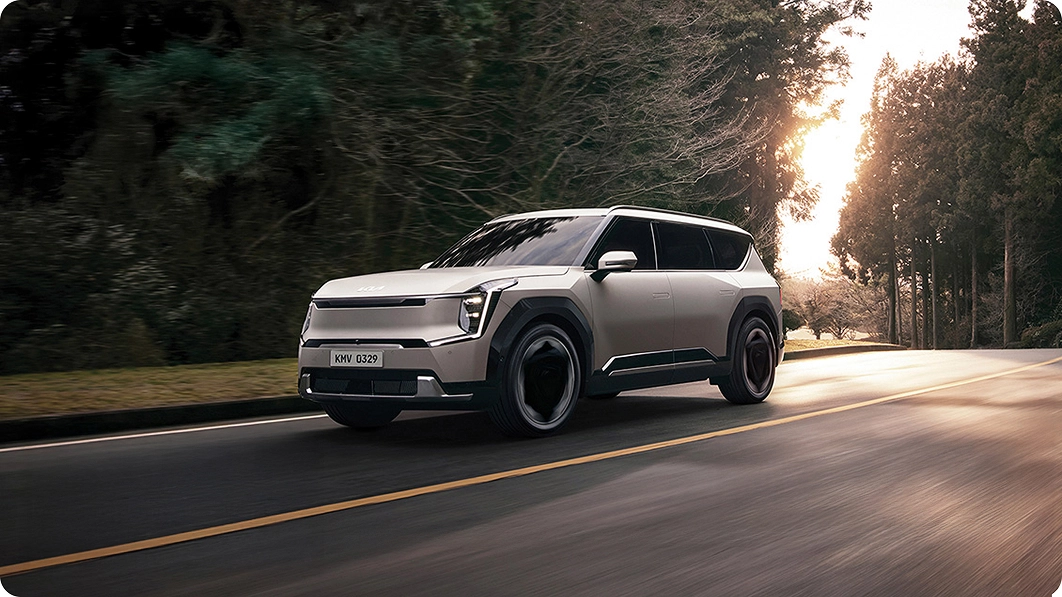 Kia EV9 driving on a city road