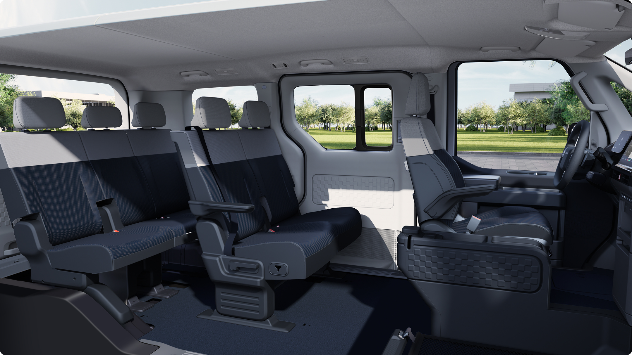 Interior view of the Kia PV5 Passenger showing multi-row seating and spacious cabin layout