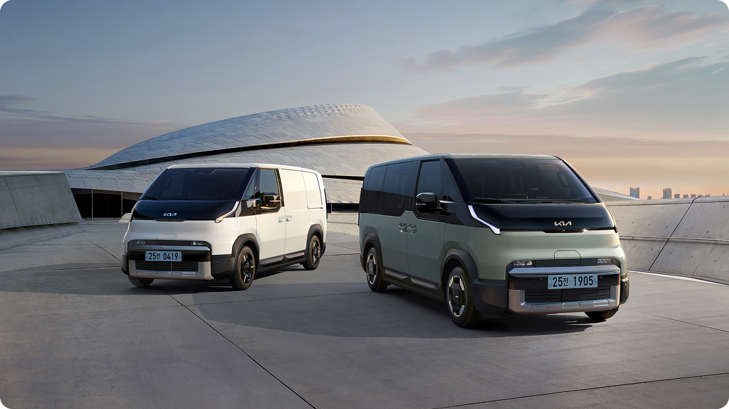 Two Kia PV5 vehicles parked side by side in an outdoor space