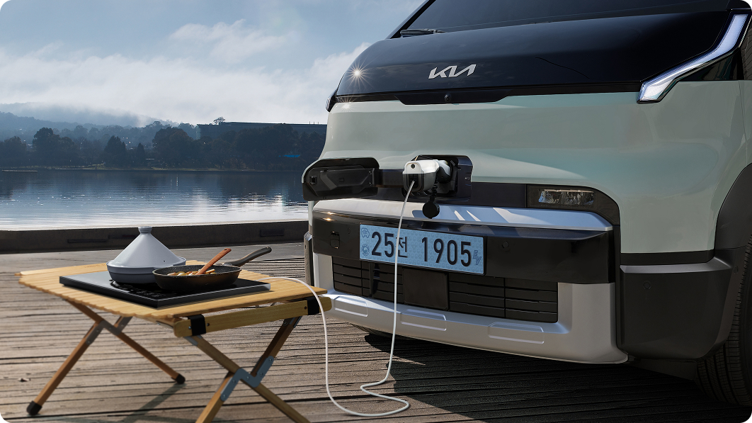 Scene of using electronic devices outdoors with Kia PV5 V2L function