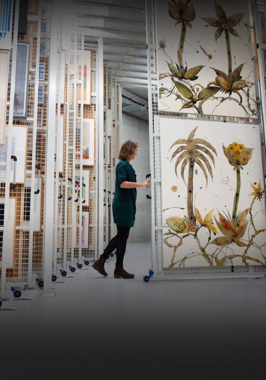 An exhibition storage space lined with artwork racks