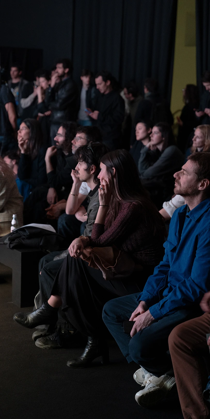 Audience seated and watching a performance.