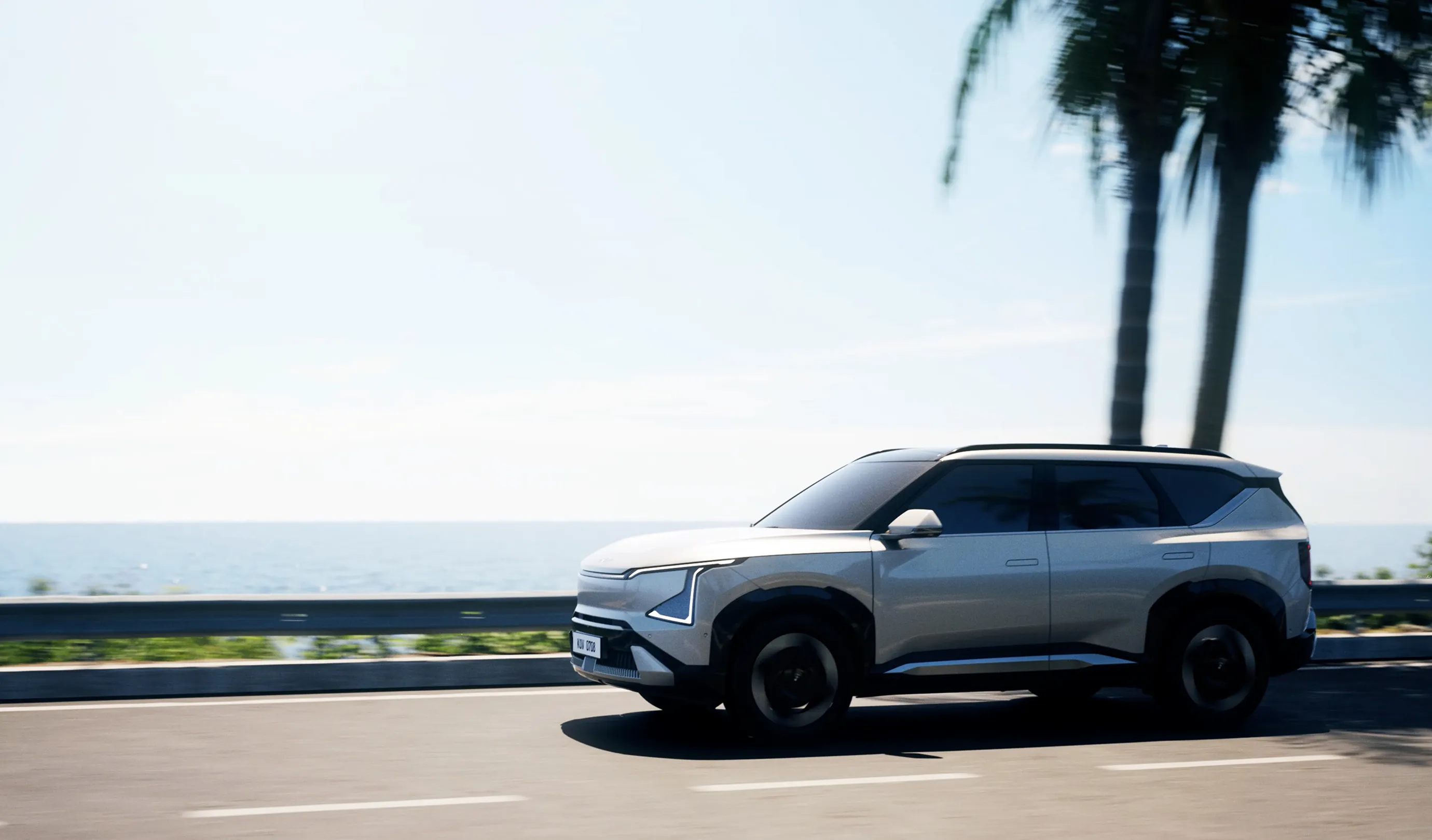 The EV5 driving along a coastal road.