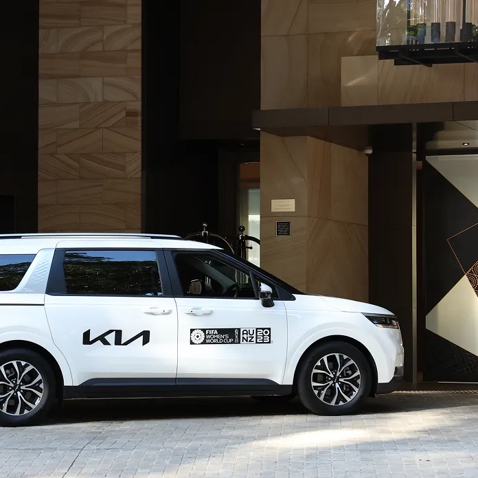 Kia Carnival official FIFA World Cup vehicle parked at a hotel entrance