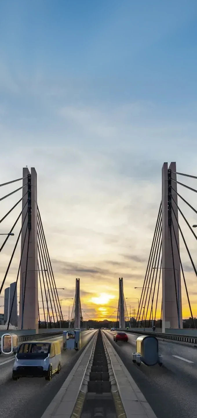 도심 교량 위를 기아의 미래 모빌리티가 주행하는 전경 이미지