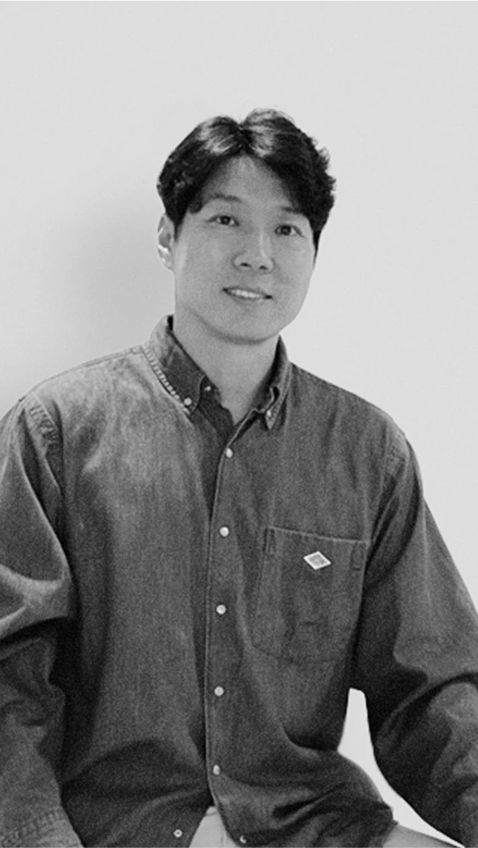 Black-and-white profile portrait of Dongho Shin, Head of Kia Design Management