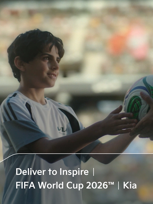 Child receiving an official match ball in the OMBC campaign film