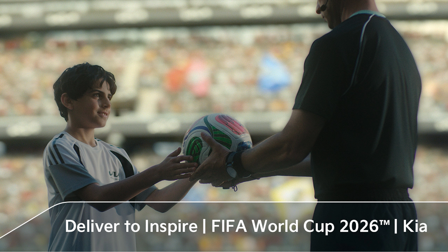 Child receiving an official match ball in the OMBC campaign film