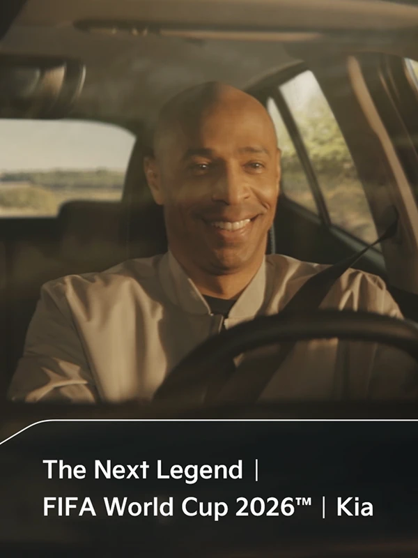 Official Match Ball Carrier child and football legend Thierry Henry riding in a vehicle in the OMBC campaign film