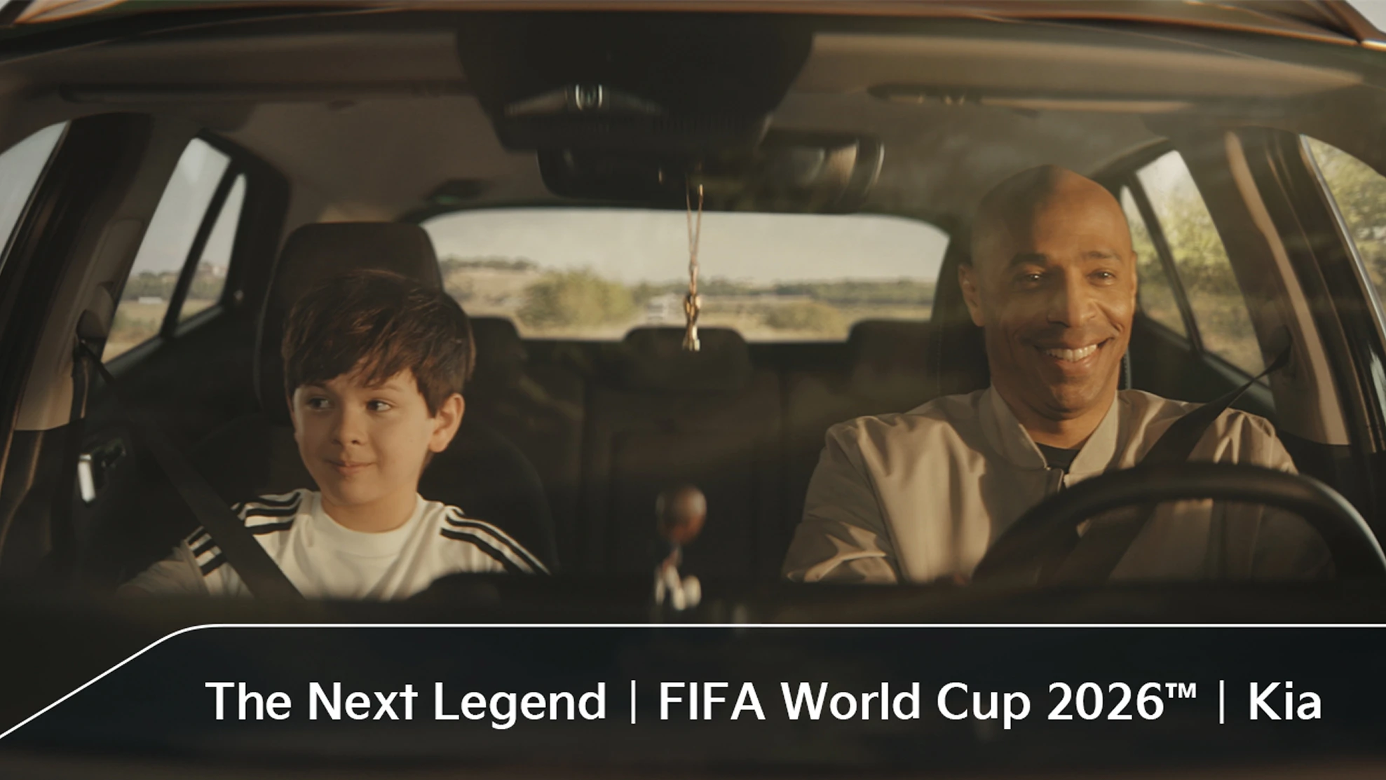 Official Match Ball Carrier child and football legend Thierry Henry riding in a vehicle in the OMBC campaign film