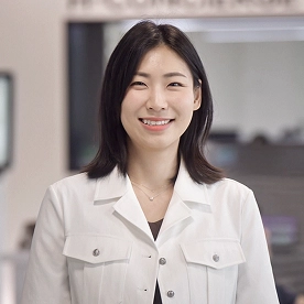Hyunkyung Lee of Kia Korea smiling during an interview in the headquarters lobby