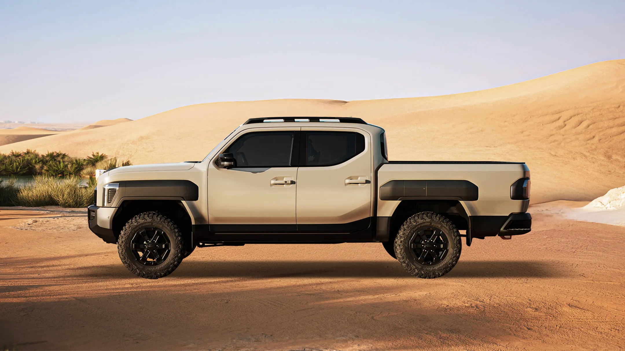 황금빛 사막 배경 속에 정차한 기아 타스만 픽업트럭의 측면 모습
