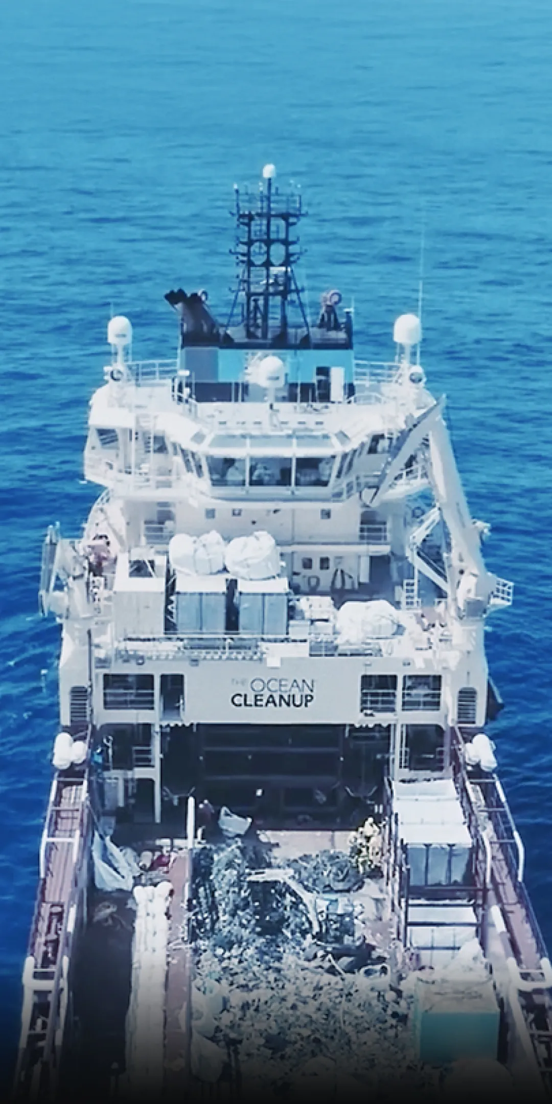 Ocean Cleanup vessel by Kia collecting marine waste at sea